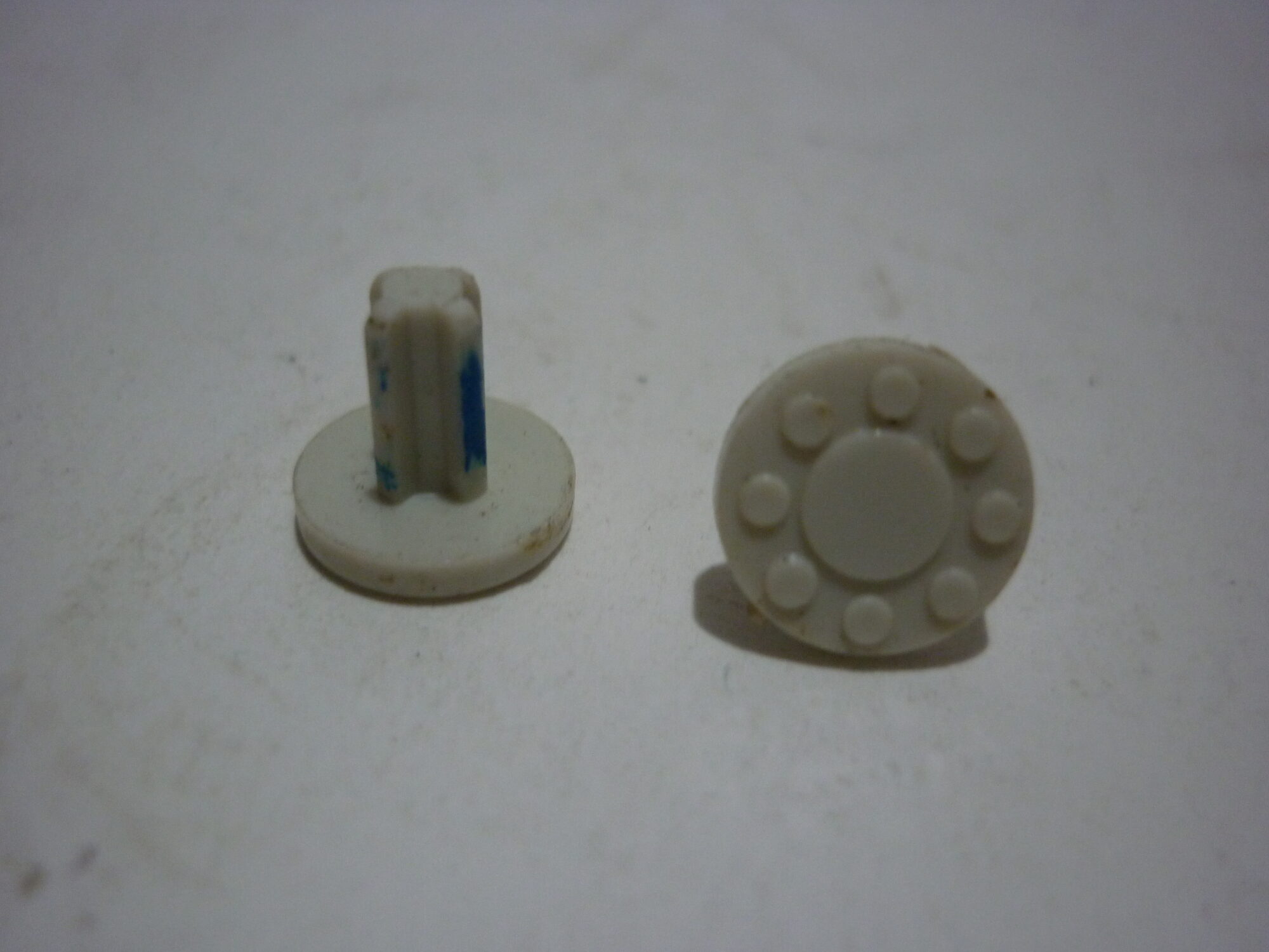 Old Britains Pair of White Wheel Studs